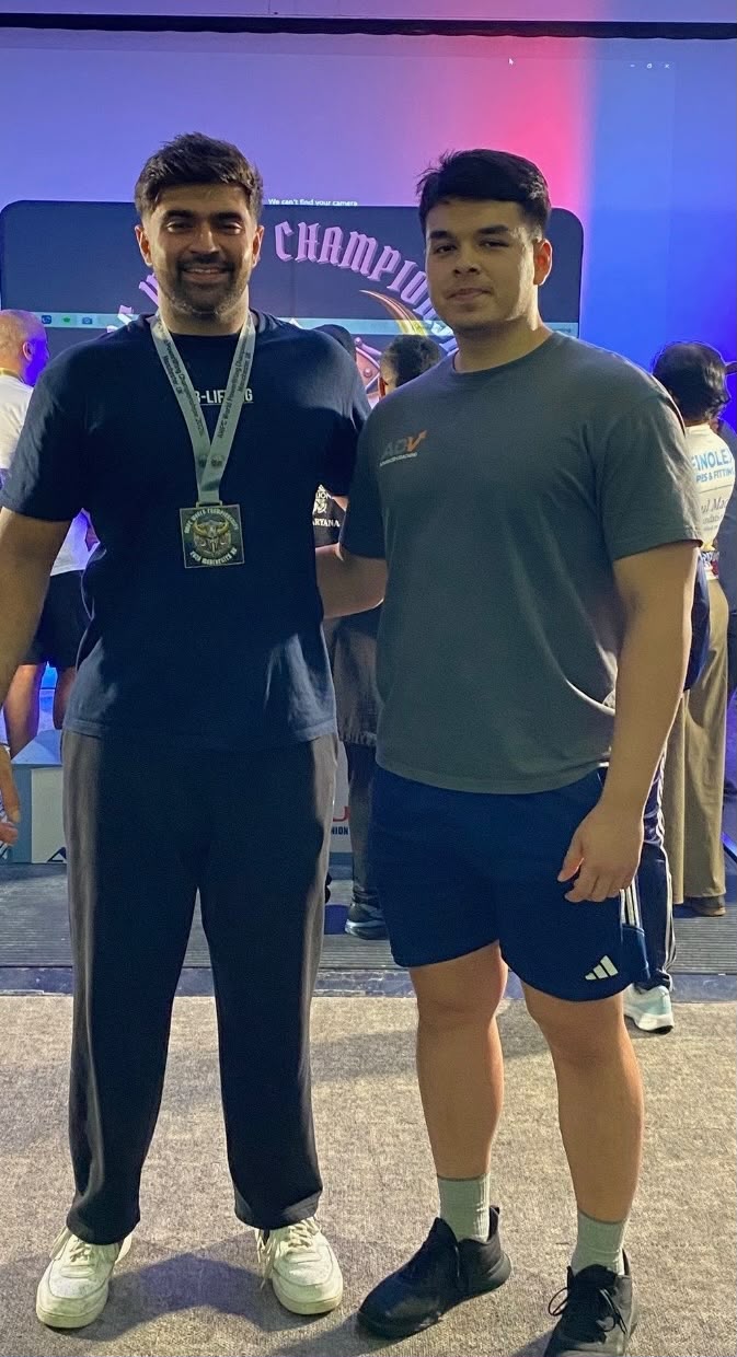 Rohan B and coach Myles after winning silver at the 2026 AWPC World Championships